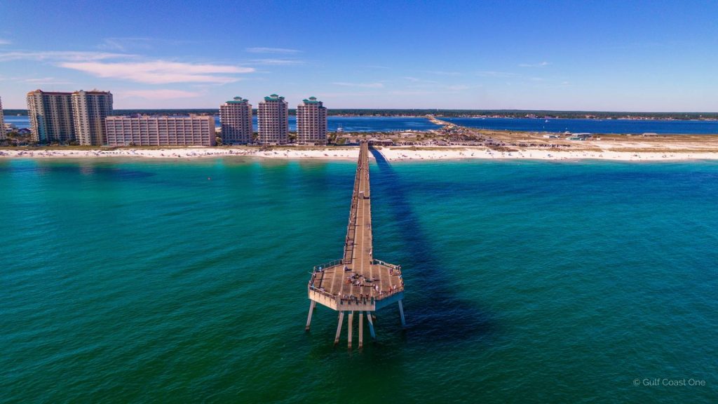 An overview of Navarre Beach, highlighting its tranquil beaches, year-round appeal, diverse activities like fishing and snorkeling, and tips for eco-friendly exploration