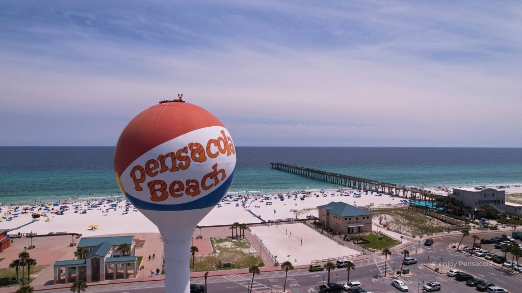 An aerial view of Pensacola Beach, showcasing its crystal-clear waters and pristine sandy shores, inviting readers to discover if this destination is an unforgettable experience worth visiting